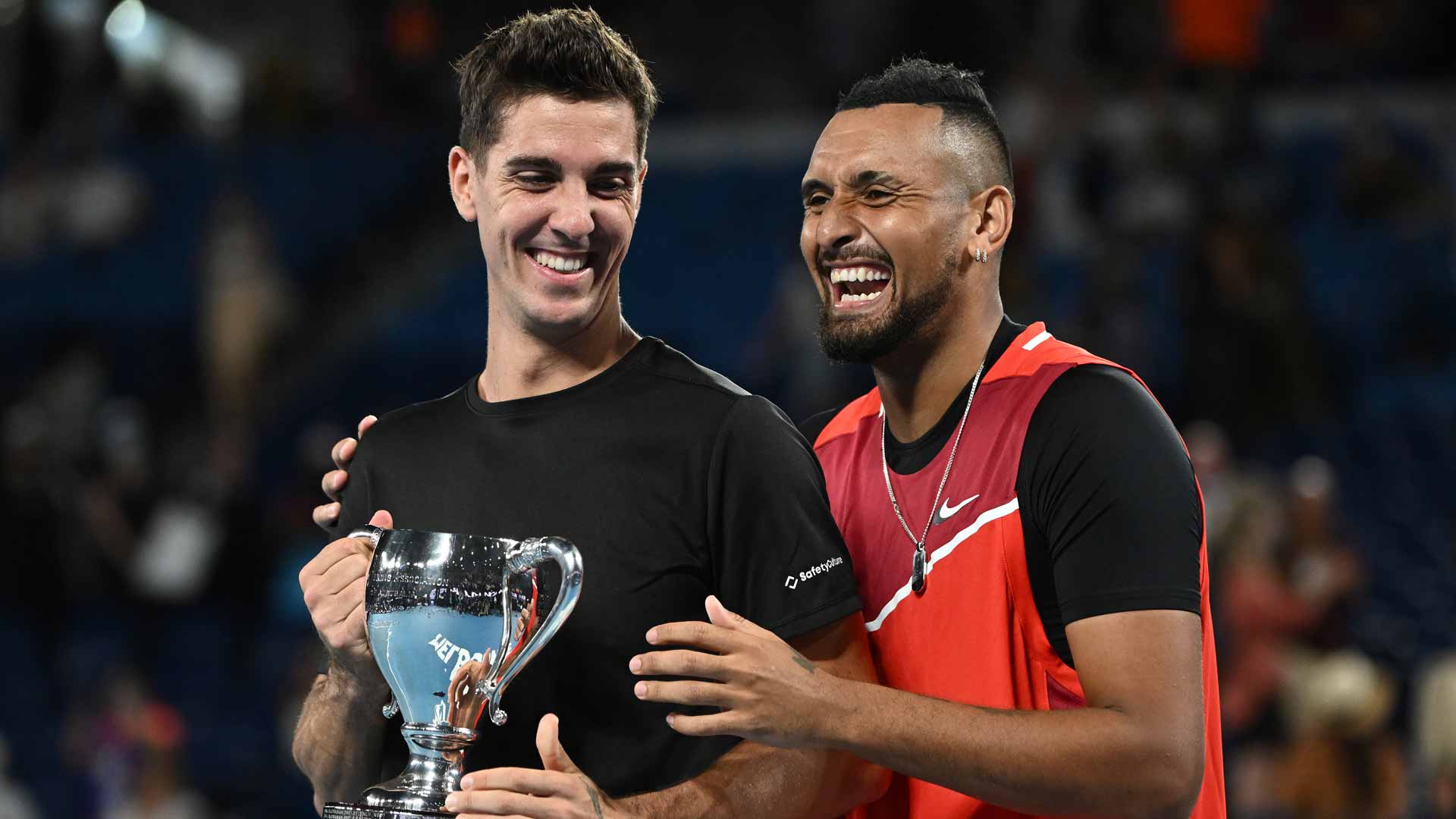 Thanasi Kokkinakis (left) and Nick Kyrgios celebrate winning the Australian Open title.